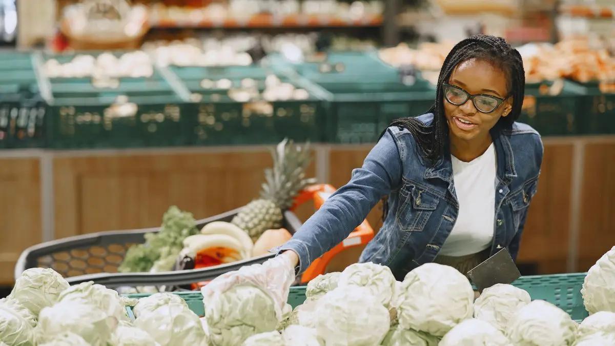 A woman choosing fresh vegetables for healthy meals
